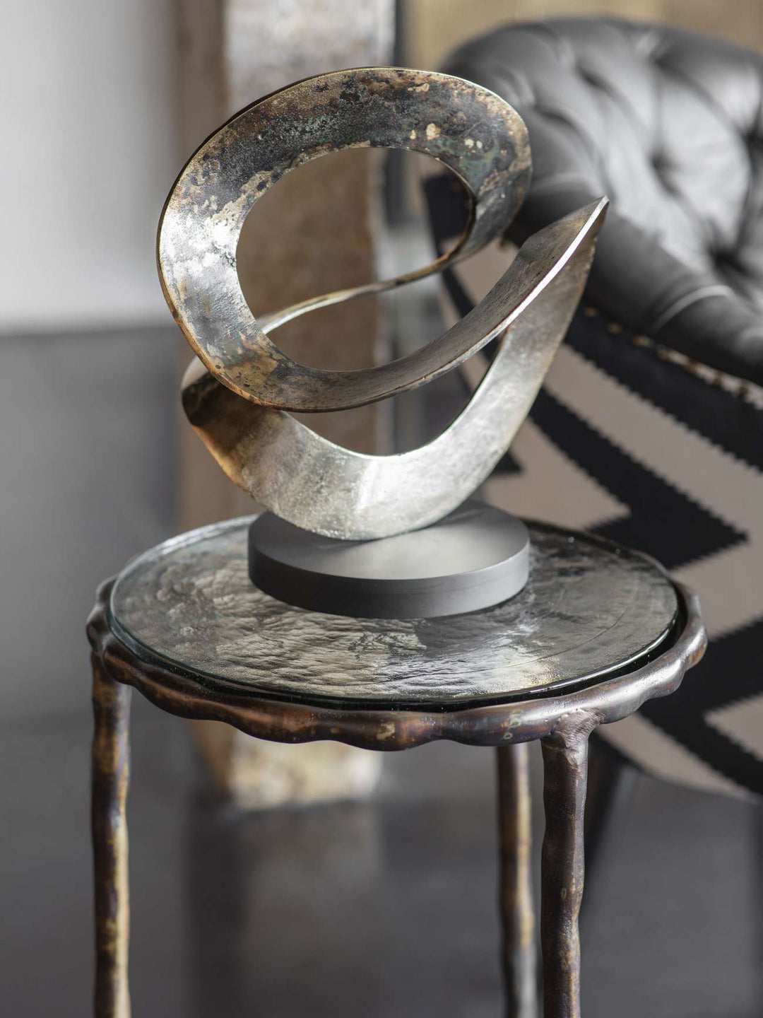 Ribbon Knot Sculpture on Black Wooden Base