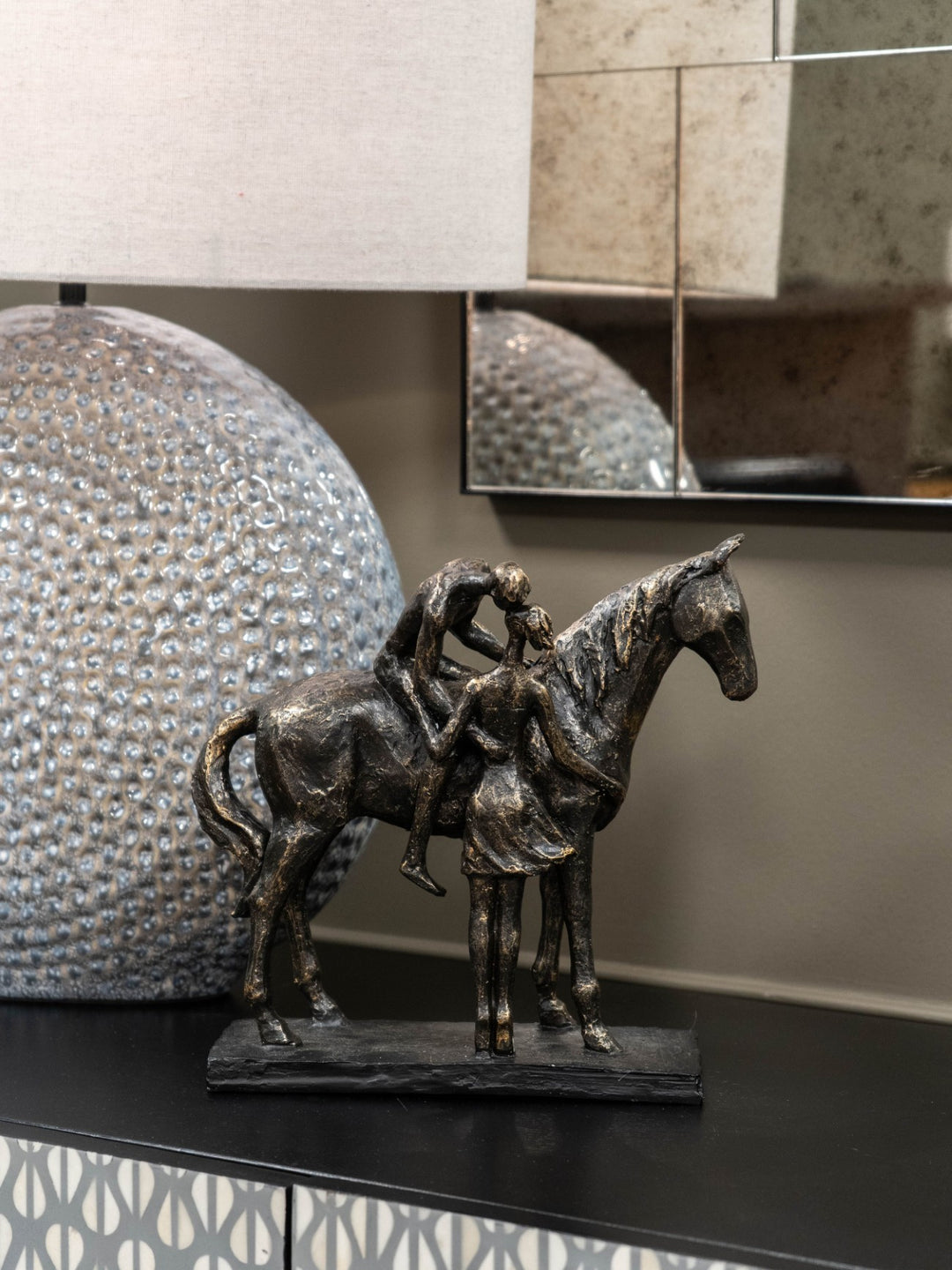 Kissing Couple with Horse Sculpture