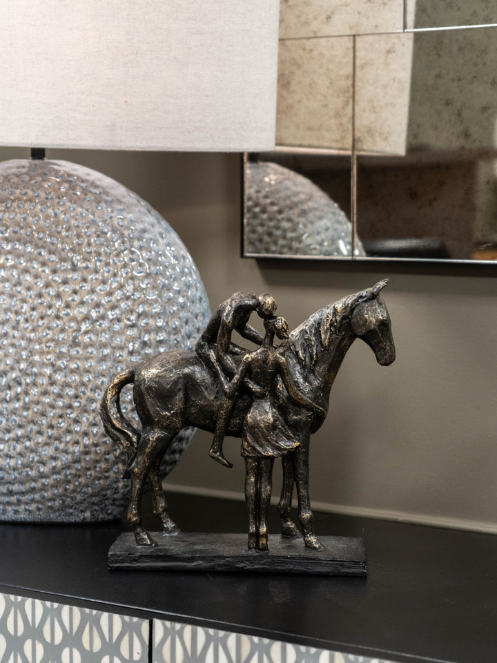 Kissing Couple with Horse Sculpture