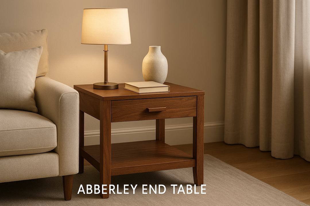A high-quality lifestyle image of the "Abberley End Table" in rich brown wood, placed beside a sofa or armchair in a modern living room with warm lighting and neutral décor. The table features clean lines and natural wood texture, styled with simple items like a lamp, a ceramic vase, or a book. Shot in a wide-angle composition with soft shadows and a cozy, inviting tone, aspect ratio 16:9, ideal for an ecommerce homepage slider.

